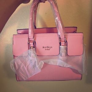 pastel pink purse with matching wallet